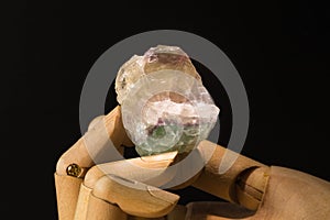 Fluorite minÃ©ral stone, uncut raw mineral on black background, white background, galaxy space background