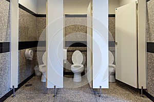 Flush toilet in Public three rooms toilet and open door