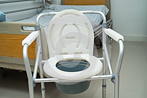 Flush toilet and shower chair in bathroom for old elder people