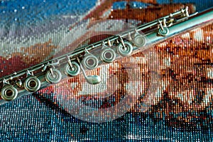 Flute on bright colored background of beads