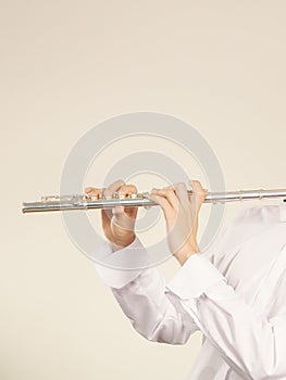 Flute music instrument in hands of flutist musician
