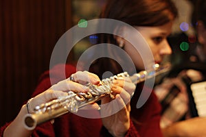 Flute player girl play some music during vacation