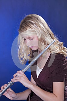 Flute Player Isolated on Blue