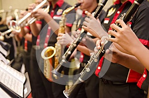 Flute, trumpet and saxophones orchestra perfom by high school bo