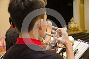 Flute, trumpet and saxophones orchestra perfom by high school bo