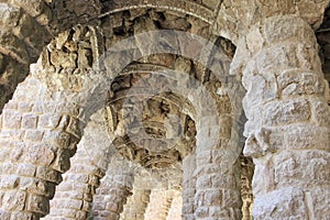 The fluted arches of massive stone columns in the Park of Guel Barcelona. photo