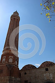 Fluted Minaret Mosque - famous symbol and landmark of Antalya, Turkey against blue spring sky