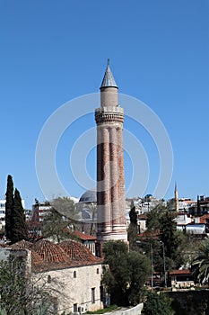 Fluted Minaret Mosque - famous symbol and landmark of Antalya, Turkey against blue spring sky