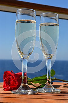 Flutes of champagne and romantic rose.