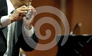 Flutist on concert photo