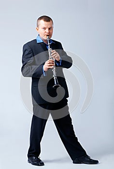Flutist is Playing on Flute. photo