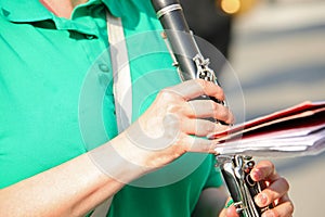 flutist playing the flute wearing a green shirt photo