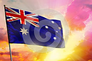 Fluttering Australia flag on beautiful colorful sunset or sunrise background. Success concept