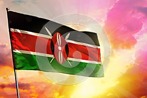 Fluttering Kenya flag on beautiful colorful sunset or sunrise background. Success concept.