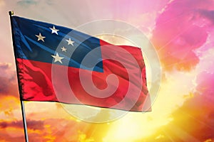 Fluttering Samoa flag on beautiful colorful sunset or sunrise background. Success concept