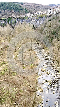 FluviÃ¡ River as it passes through Castellfullit de la Roca in the region of La Garrotxa photo