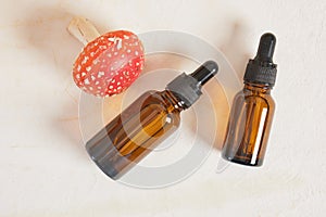 fly agaric red and glass amber dropper bottles