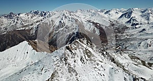 Fly around the snowy peaks of the peak. Shooting with the drone.