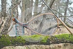 Fly box and fishing tackle on the river bank