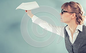 Fly fear. Woman holding airplane in hand.