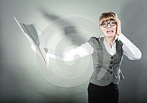 Fly fear. Woman holding airplane in hand.