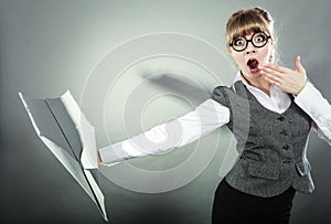 Fly fear. Woman holding airplane in hand.