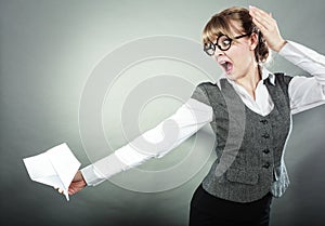 Fly fear. Woman holding airplane in hand.