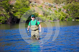 Fly Fisherman Casting on the Deschutes River