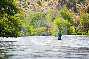 Fly Fisherman Casting on the Deschutes River