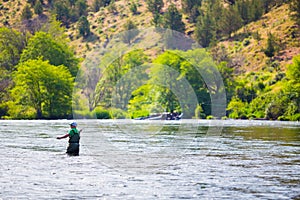 Fly Fisherman Casting on the Deschutes River