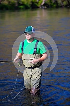 Fly Fisherman Casting on the Deschutes River