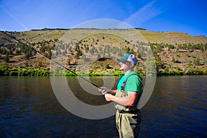 Fly Fisherman Casting on the Deschutes River