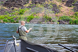 Fly Fisherman Casting on the Deschutes River