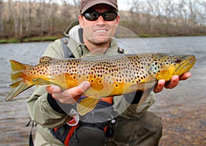 Fly fishing - fisherman with large fish