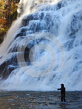 Fly fishing at Ithaca Falls after a heavy Autumn rain photo