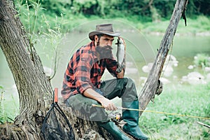 Fly fishing is most renowned as a method for catching trout and salmon. Fisher man fishing with spinning reel. Concepts