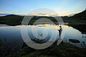 Fly fishing on the mountian lake