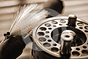 Fly fishing reel and lure on dock