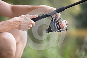 fly fishing rod in fisherman hand