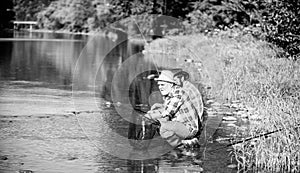 Fly Fishing Time. retired dad and mature bearded son. Catching and fishing. happy fishermen friendship. Two male friends