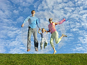 Fly happy family under cloudfield photo