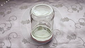 Fly inside upside down jar cleaning itself