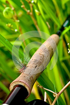 Fly Rod with Fly on Handle 1