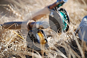 Fly rods in dry grass photo