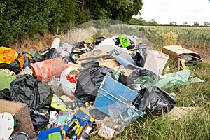 Fly tipping of household waste in a country lane. Hertfordshire. UK