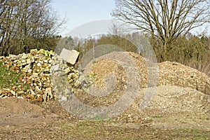 A fly tipping scene of bricks and other construction waste dumped in the countryside