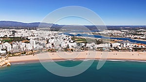 Flyaway footage reveals panoramic view of Praia da Rocha and Portimao, Portugal