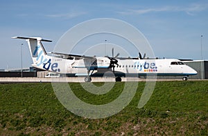 Flybe Bombardier DHC-8 Q400 G-KKEV passenger plane taxiing at Amsterdam Schipol Airport