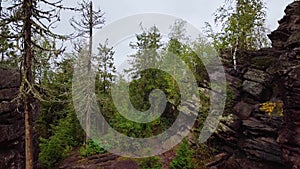 Flyiing Through Stone Town in Summer in the Urals, Russia. Aerial View of Natural Attraction