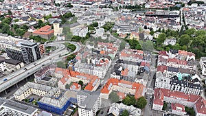 Flying Above Bergen, Norway. City Downtown Residential Buildings and Streets